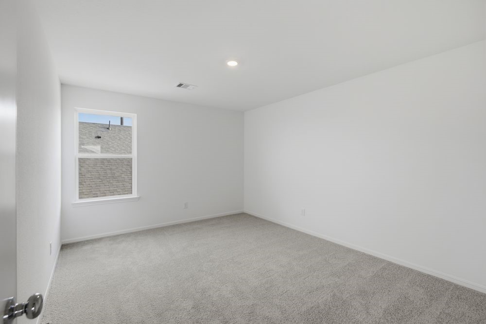 5607 Buttonbush Court Rosenberg, TX 77471 - Photo 23 of 37 an empty room with a window