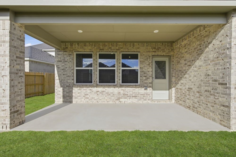 5607 Buttonbush Court Rosenberg, TX 77471 - Photo 27 of 37 a front view of a house with a yard and garage
