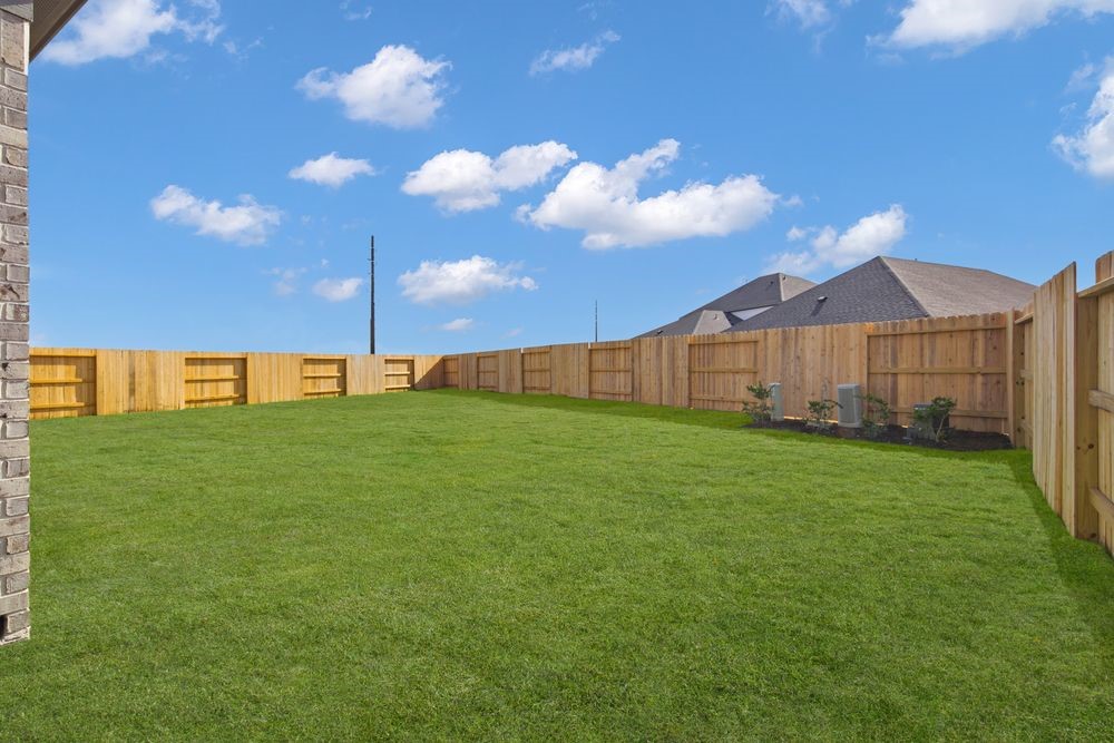 5607 Buttonbush Court Rosenberg, TX 77471 - Photo 28 of 37 a view of a back yard of the house with green space
