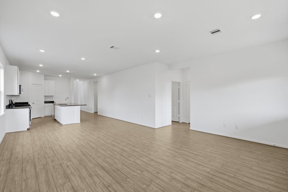 5607 Buttonbush Court Rosenberg, TX 77471 - Photo 4 of 37 a view of an empty room with wooden floor