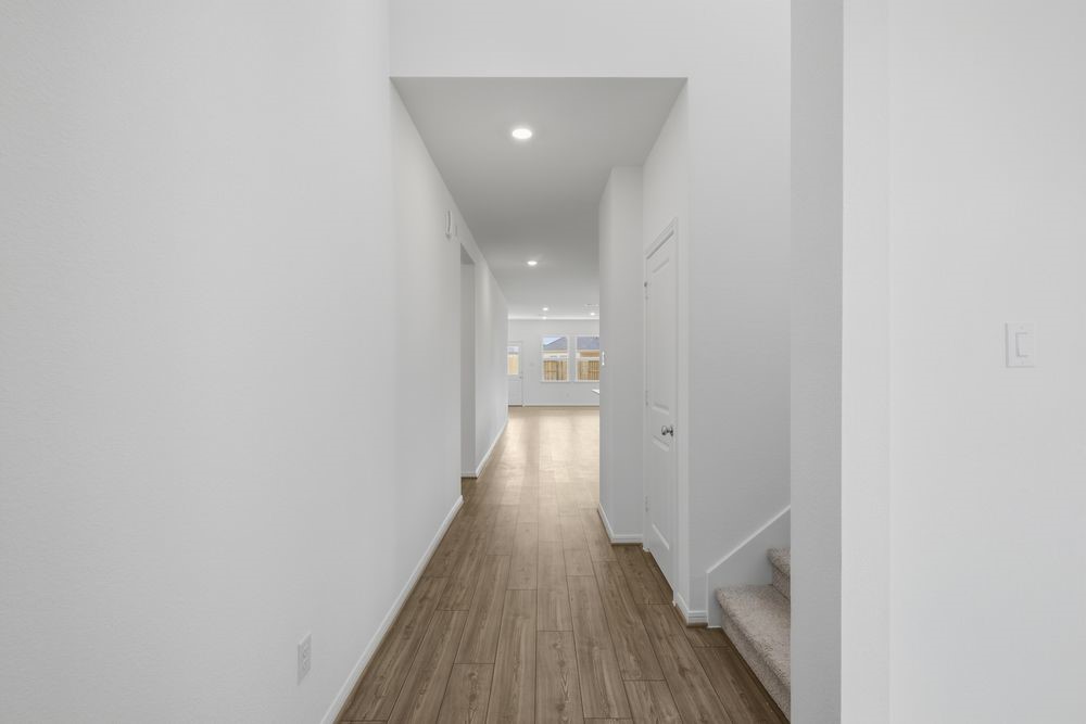 5607 Buttonbush Court Rosenberg, TX 77471 - Photo 5 of 37 a view of a hallway with wooden floor