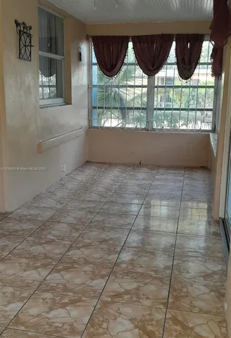 a view of entrance gate of the house and window