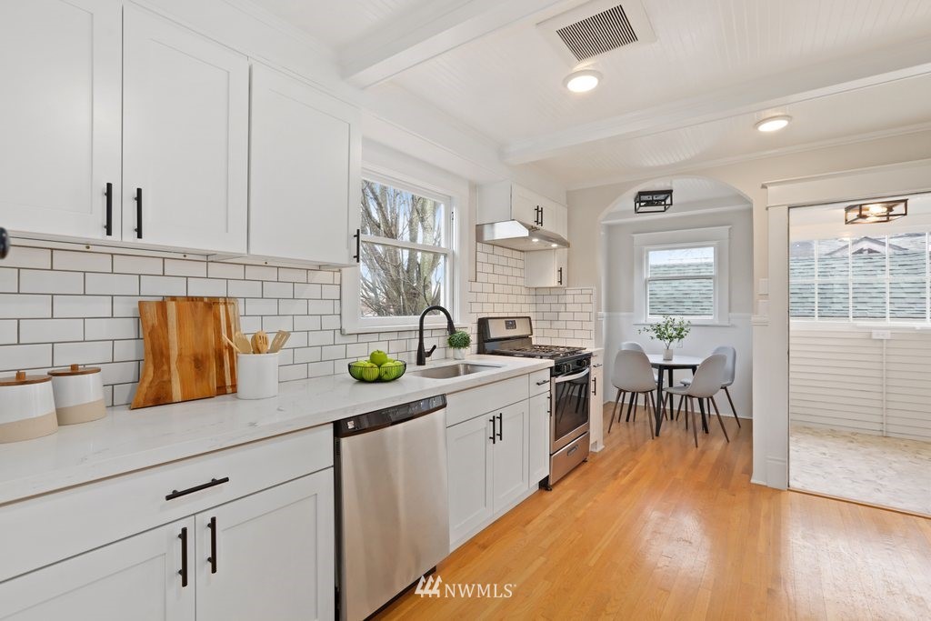1631 Oakes Avenue Everett, WA 98201 - Photo 13 of 39 a kitchen with sink cabinets and wooden floor