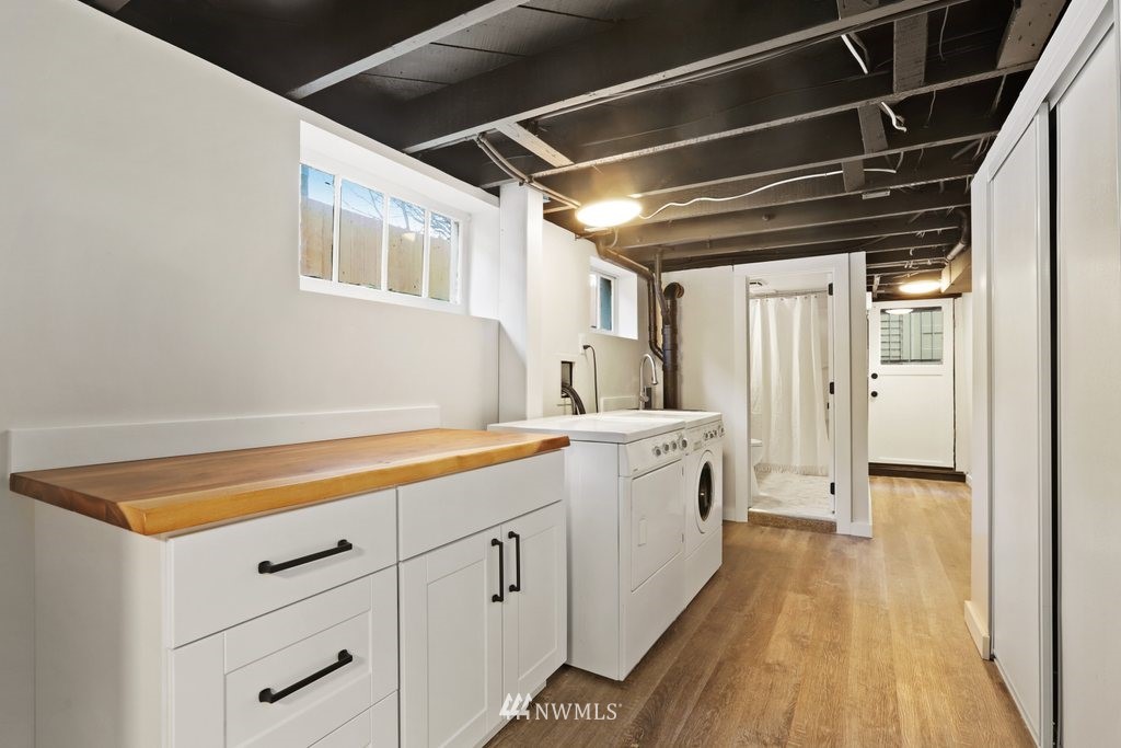 1631 Oakes Avenue Everett, WA 98201 - Photo 26 of 39 a view of a kitchen with cabinets and wooden floor