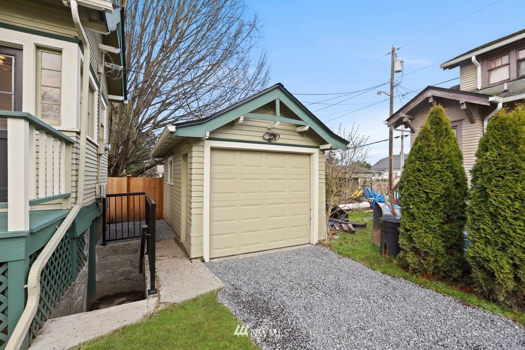 1631 Oakes Avenue Everett, WA 98201 - Photo 29 of 39 a front view of a house with a yard and garage