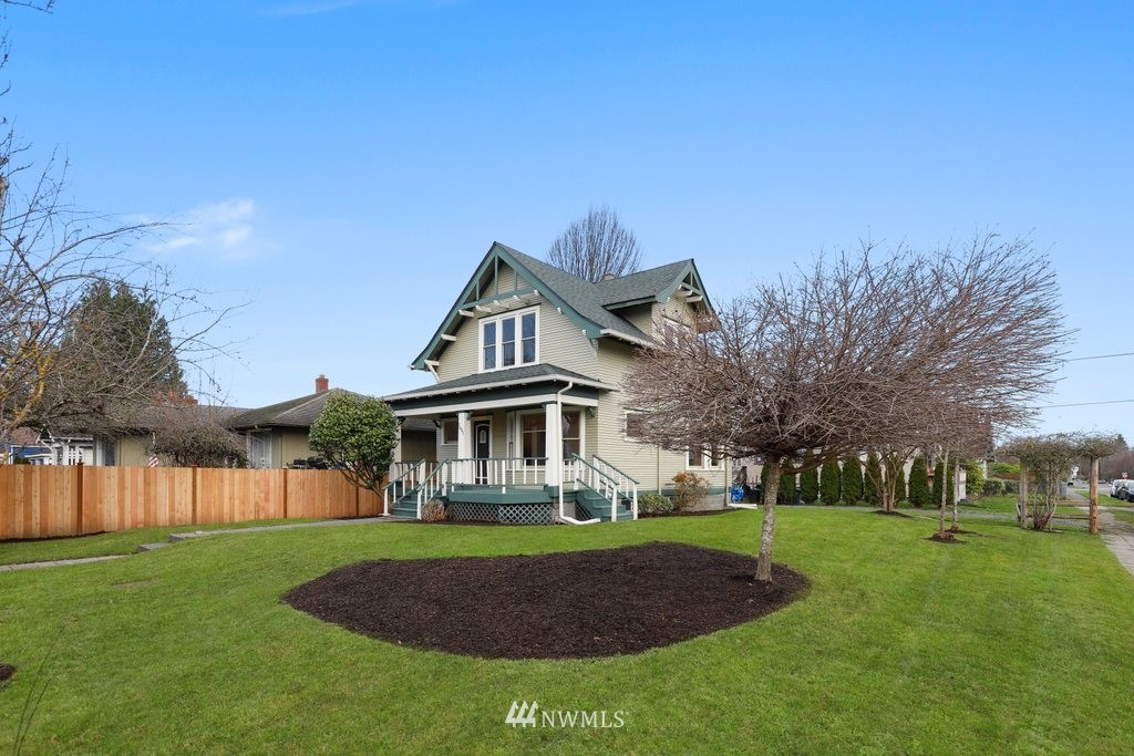 1631 Oakes Avenue Everett, WA 98201 - Photo 35 of 39 a front view of a house with a garden and trees