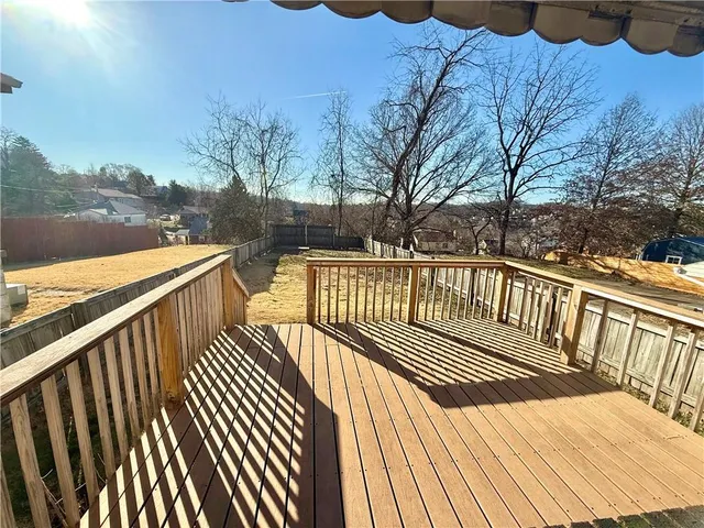 a view of balcony with wooden floor and lake view