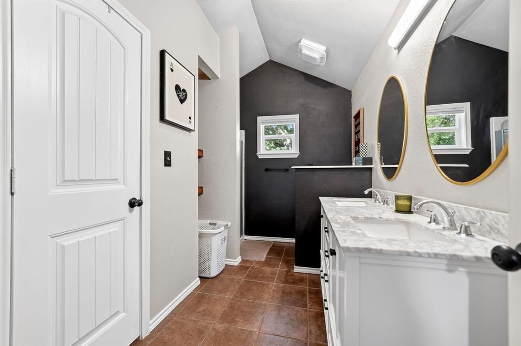 810 Edna Street Athens, TX 75751 - Photo 20 of 28 Bathroom featuring a dual vanity with white cabinetry, stone countertops, and undermount sinks