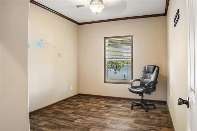 a view of workspace with a window and gym cycle