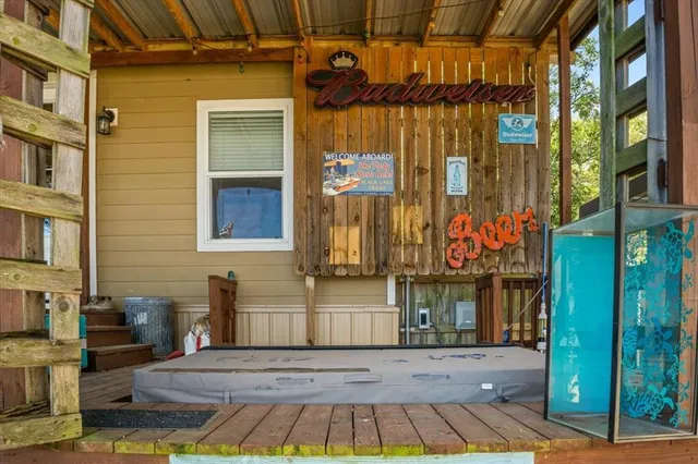 a view of a brick house with large windows