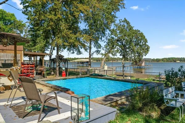 a view of a backyard with sitting area