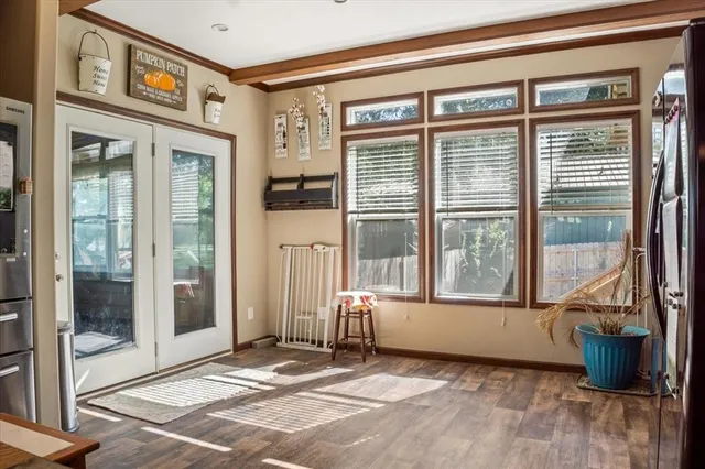 a view of a entrance door of the building and a window