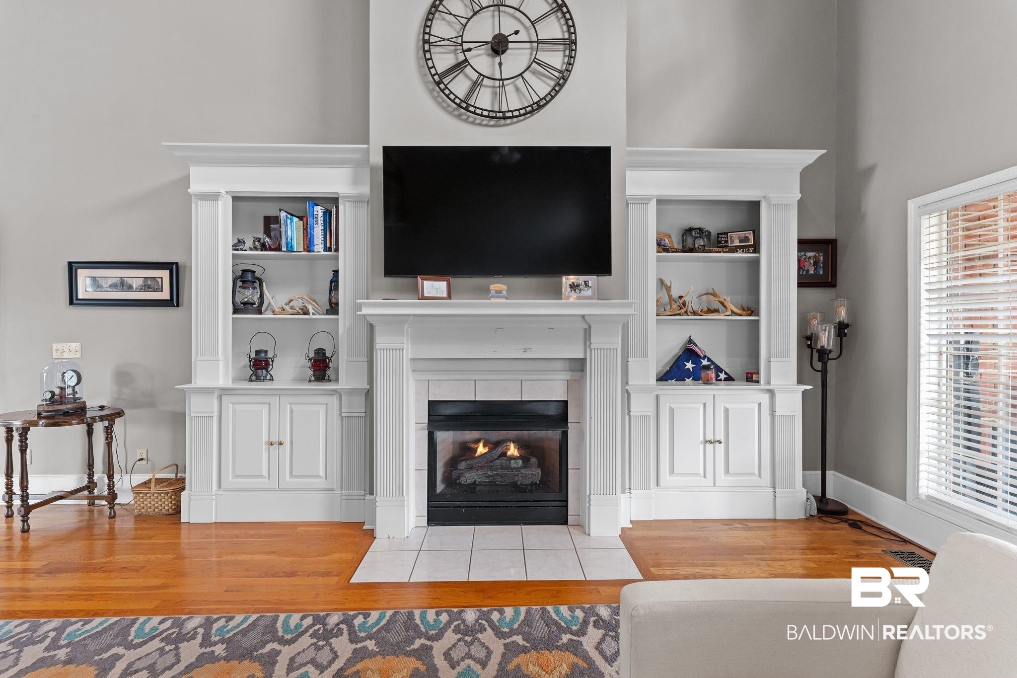 525 Norwood Road Monroeville, AL 36460 - Photo 8 of 55 Living room with wood finished floors, a tile fireplace, and a towering ceiling