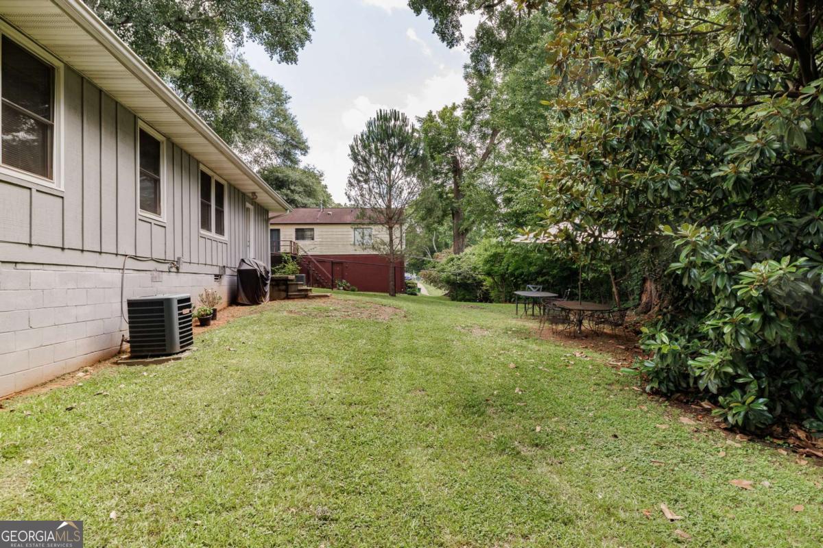 168 Pearl Street Athens, GA 30601 - Photo 28 of 43 a view of a house with backyard and sitting area