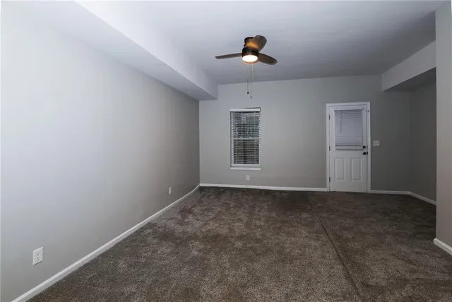 a view of empty room with windows