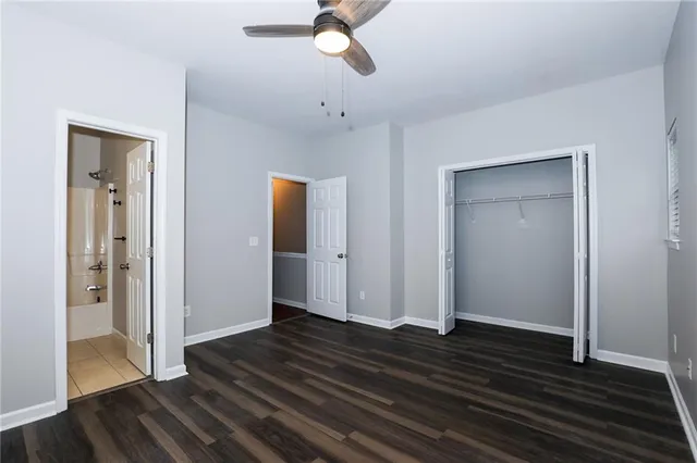 a view of a livingroom with wooden floor and closet area