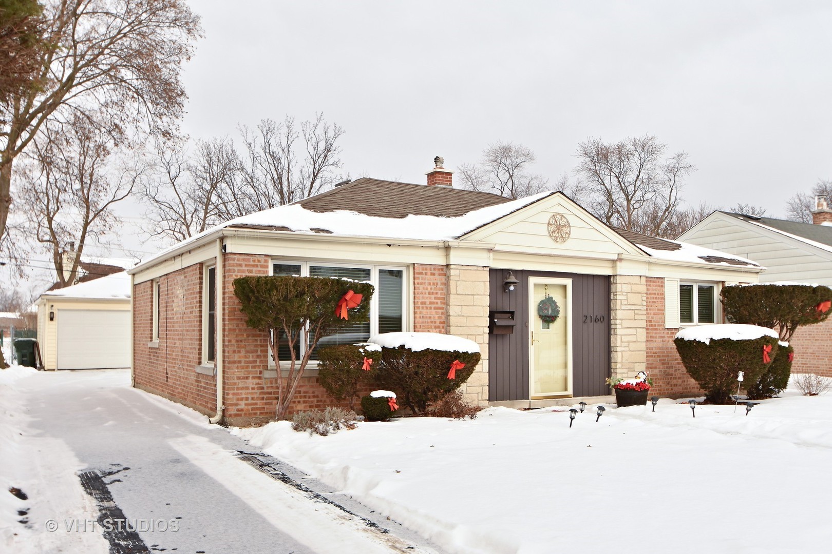 2160 Spruce Road Homewood, IL 60430 - Photo 1 of 10 a view of a house with snow on the wall