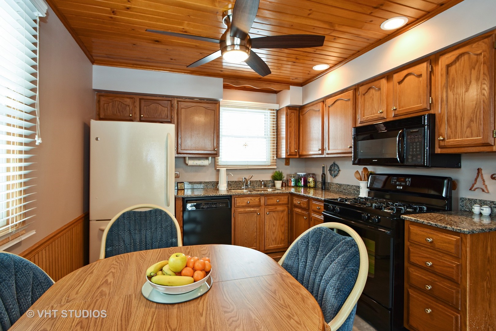 2160 Spruce Road Homewood, IL 60430 - Photo 5 of 10 a kitchen with stainless steel appliances granite countertop a refrigerator a stove top oven a sink dishwasher and wooden cabinets