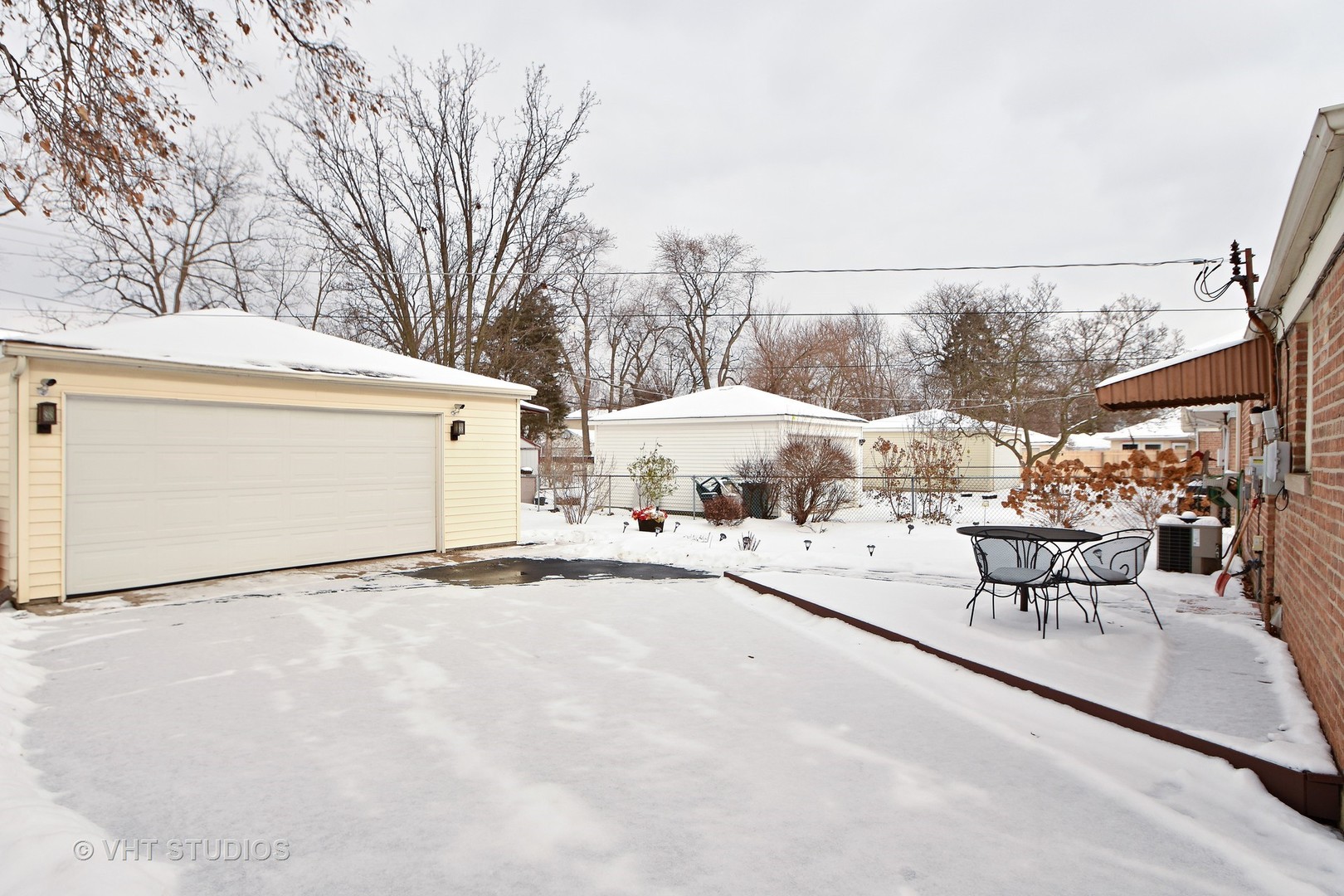 2160 Spruce Road Homewood, IL 60430 - Photo 9 of 10 a view of a patio with a table and chairs under an umbrella