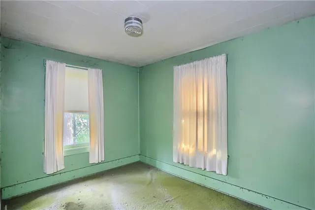 an empty room with windows