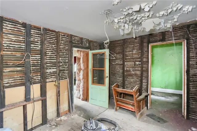a view of a porch with a table and chairs