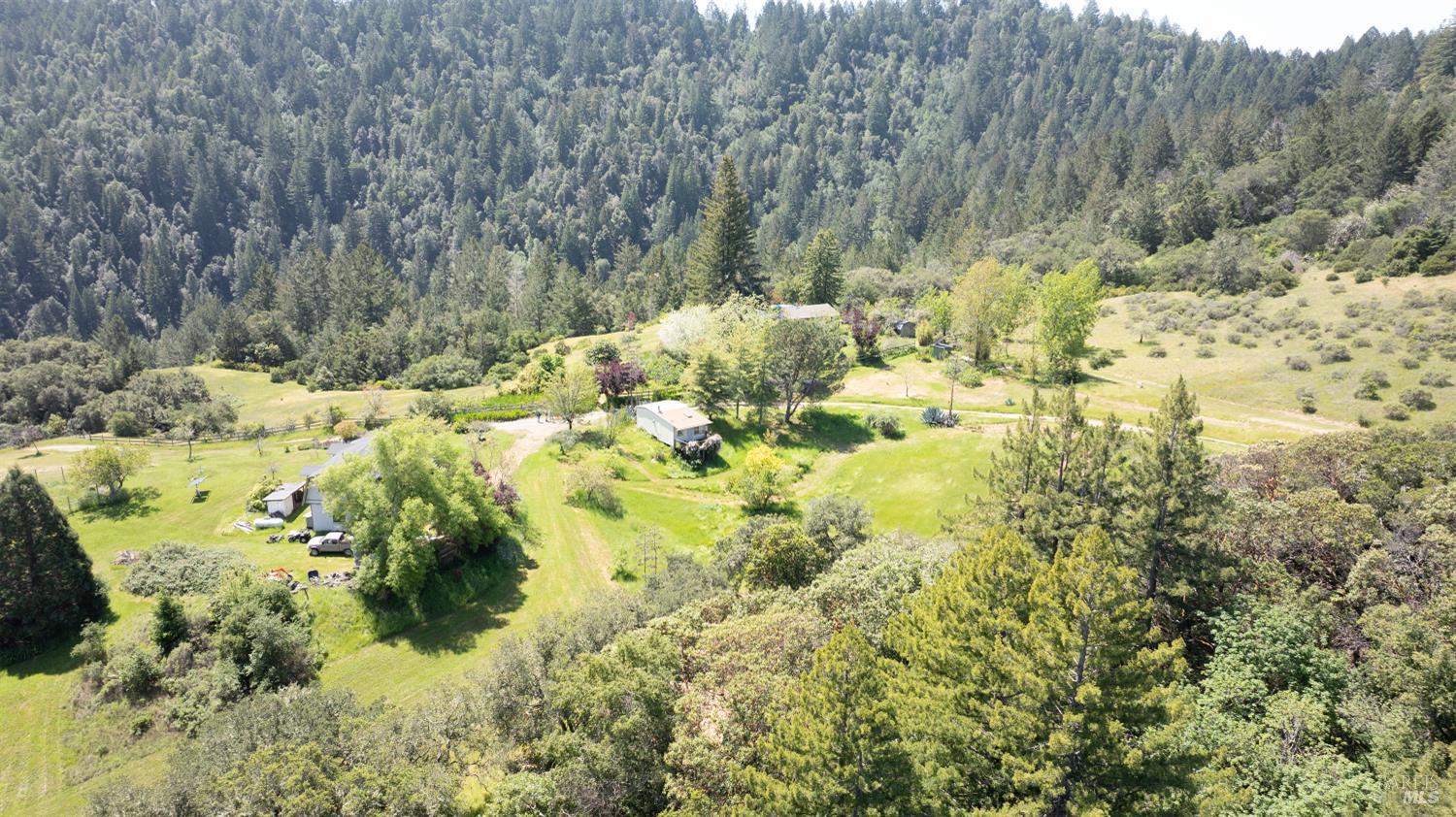 10957 Westside Road Healdsburg, CA 95448 - Photo 2 of 30 Incredible views of Black Mountain and the surrounding wilderness, the property is self-sustaining and thoughtfully designed for multi-family living.