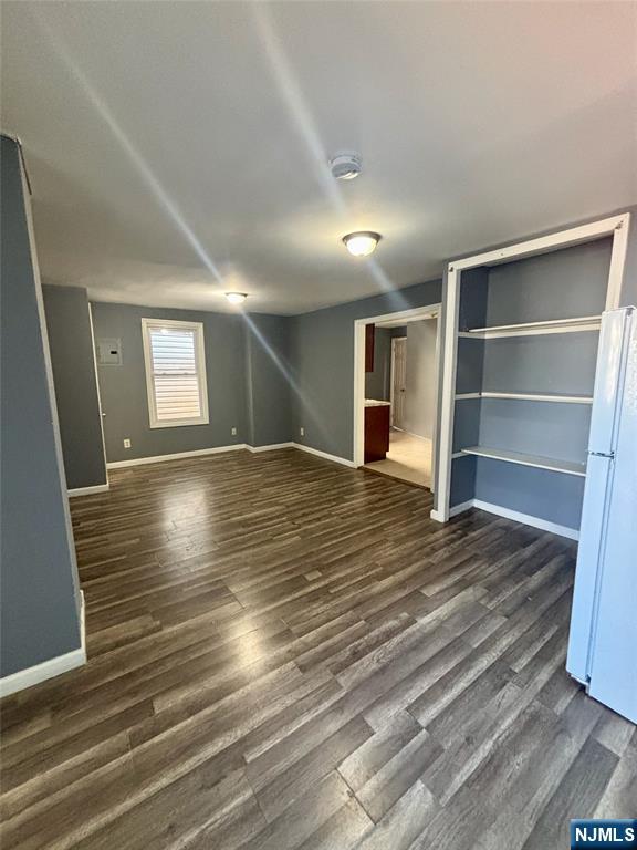 792 South 15th Street, Unit 2 Newark, NJ 07108 - Photo 3 of 10 a view of an empty room with wooden floor and a window