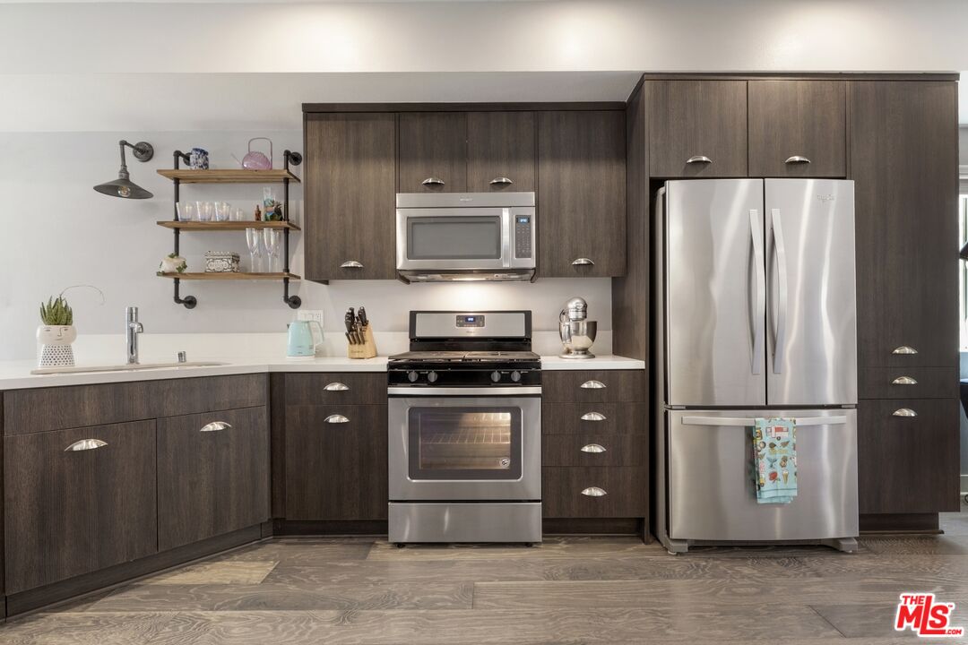 2972 Ripple Place, Unit 101 Los Angeles, CA 90039 - Photo 13 of 46 a kitchen with a refrigerator and a sink