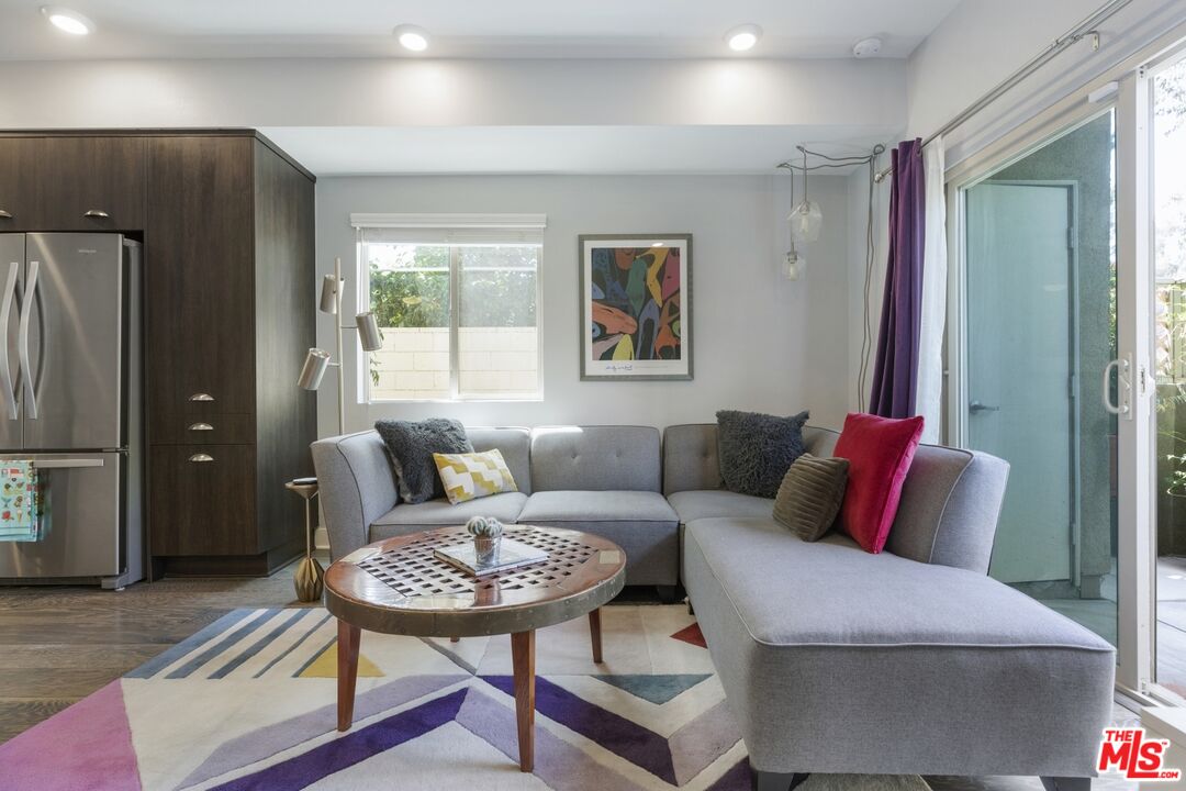 2972 Ripple Place, Unit 101 Los Angeles, CA 90039 - Photo 15 of 46 a living room with furniture rug and wooden floor