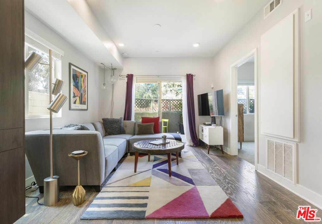 2972 Ripple Place, Unit 101 Los Angeles, CA 90039 - Photo 16 of 46 a living room with furniture and wooden floor