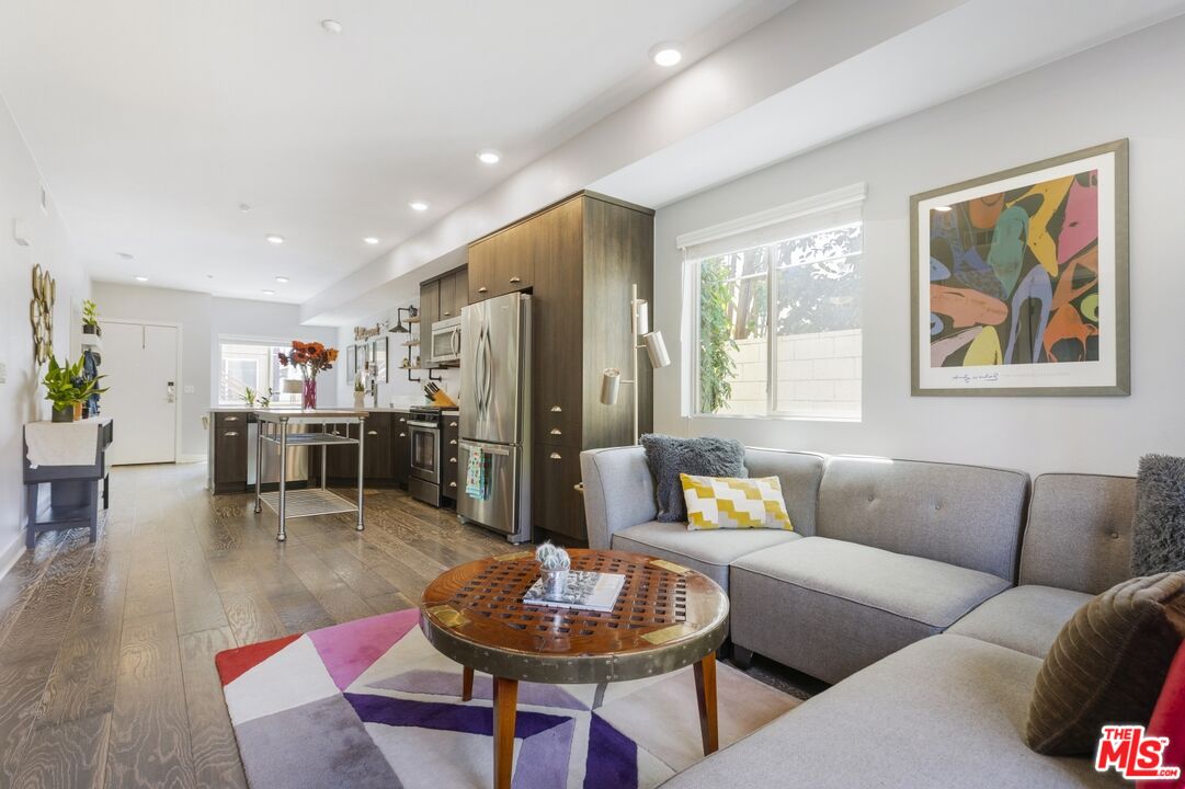 2972 Ripple Place, Unit 101 Los Angeles, CA 90039 - Photo 17 of 46 a living room with furniture kitchen view and a large window