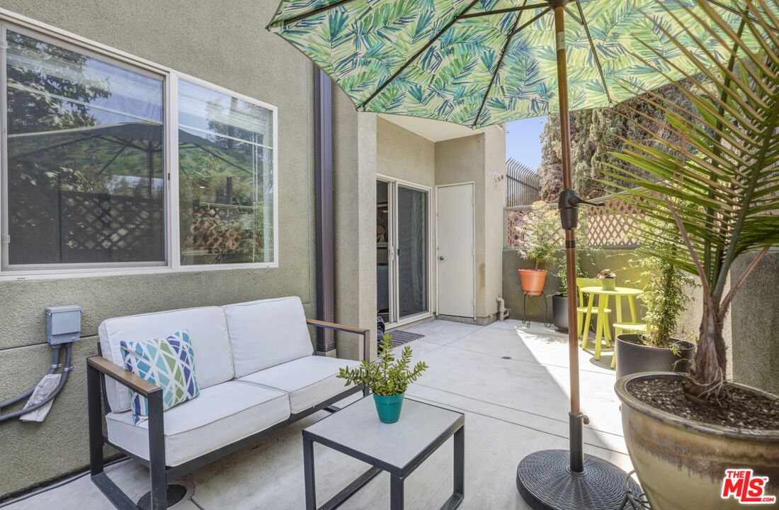 2972 Ripple Place, Unit 101 Los Angeles, CA 90039 - Photo 20 of 46 a living room with furniture and a potted plant