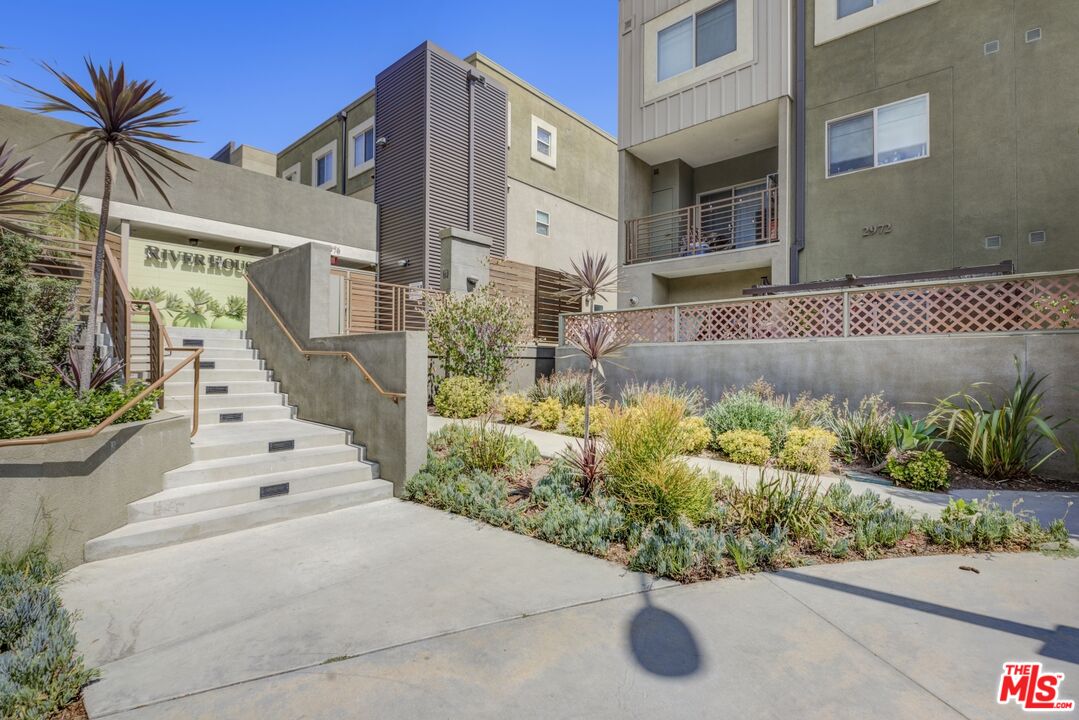 2972 Ripple Place, Unit 101 Los Angeles, CA 90039 - Photo 2 of 46 a front view of a house with a yard and potted plants