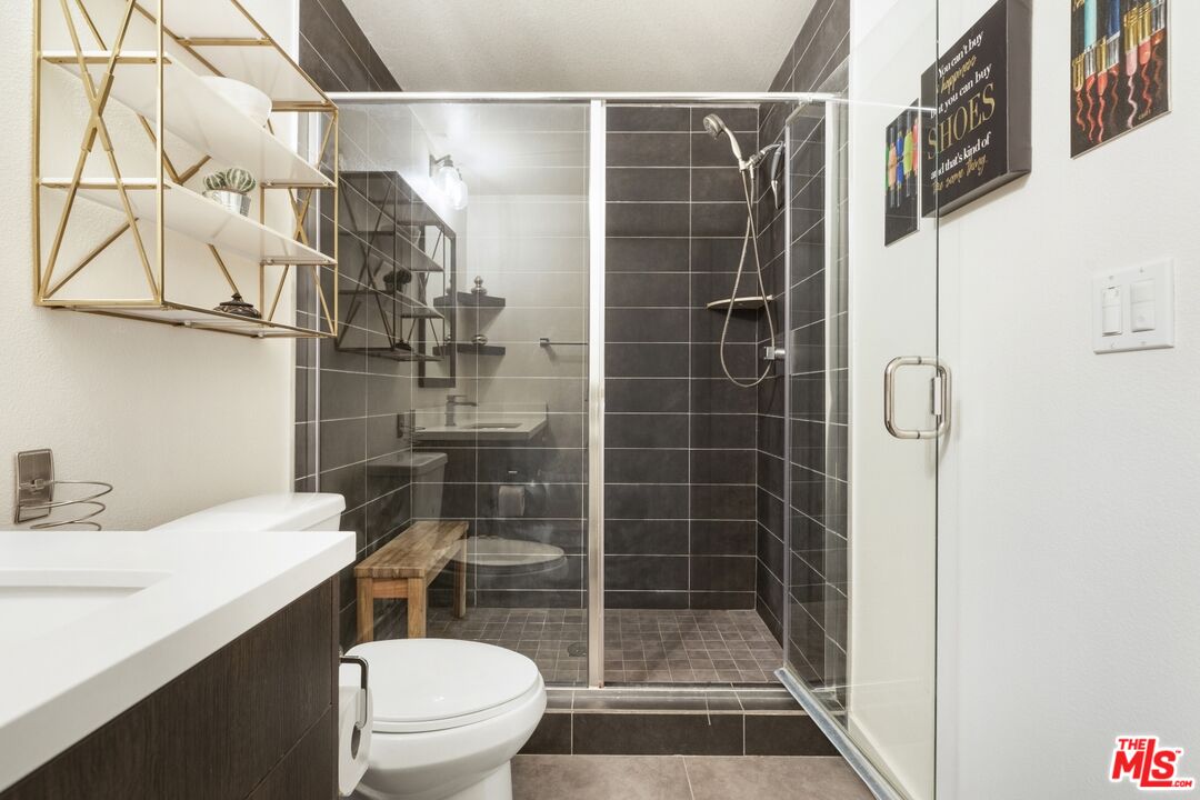 2972 Ripple Place, Unit 101 Los Angeles, CA 90039 - Photo 25 of 46 a bathroom with a sink toilet and shower