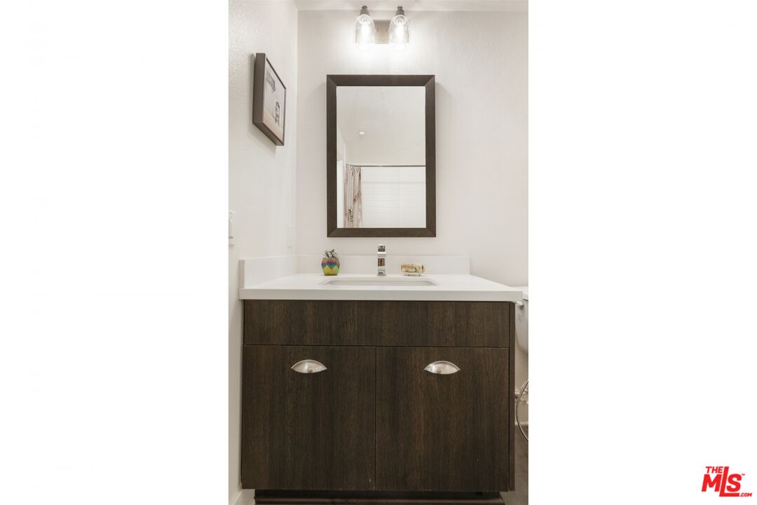 2972 Ripple Place, Unit 101 Los Angeles, CA 90039 - Photo 29 of 46 a bathroom with a sink and a mirror