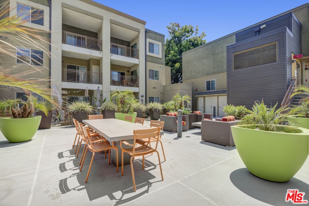 2972 Ripple Place, Unit 101 Los Angeles, CA 90039 - Photo 33 of 46 a view of a backyard with table and chairs