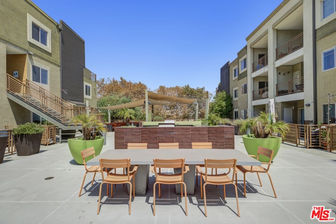 2972 Ripple Place, Unit 101 Los Angeles, CA 90039 - Photo 35 of 46 a view of a table and chairs in the patio