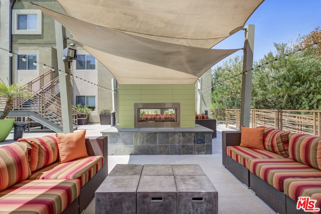 2972 Ripple Place, Unit 101 Los Angeles, CA 90039 - Photo 38 of 46 a outdoor living space with patio furniture and a fireplace