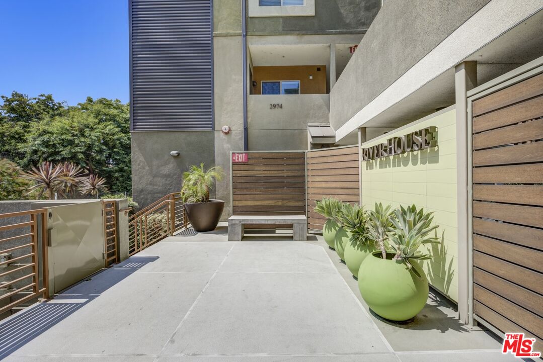 2972 Ripple Place, Unit 101 Los Angeles, CA 90039 - Photo 4 of 46 a potted plant sitting in front of a door