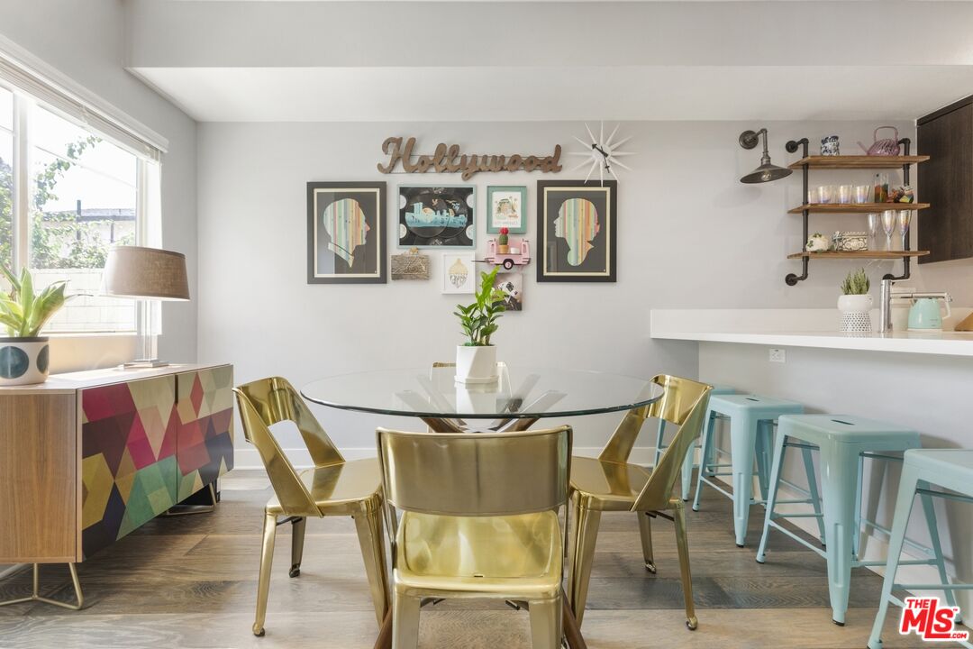 2972 Ripple Place, Unit 101 Los Angeles, CA 90039 - Photo 8 of 46 a view of a dining room with furniture and a potted plant