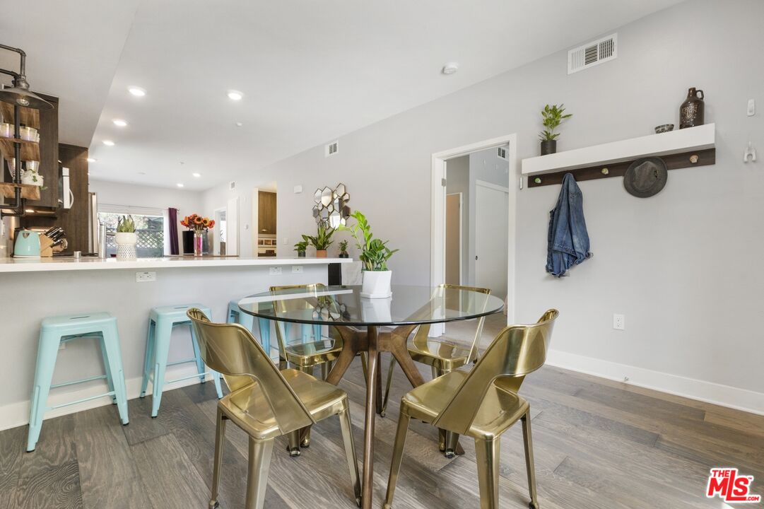 2972 Ripple Place, Unit 101 Los Angeles, CA 90039 - Photo 10 of 46 a view of a dining room with furniture and wooden floor