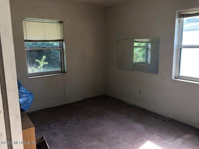 6153 Colgate Road Jacksonville, FL 32217 - Photo 11 of 25 an empty room with windows