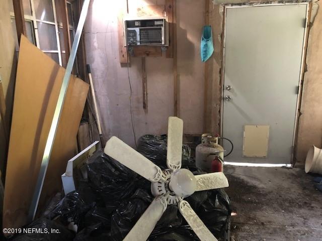 6153 Colgate Road Jacksonville, FL 32217 - Photo 7 of 25 a bathroom with a sink and a toilet