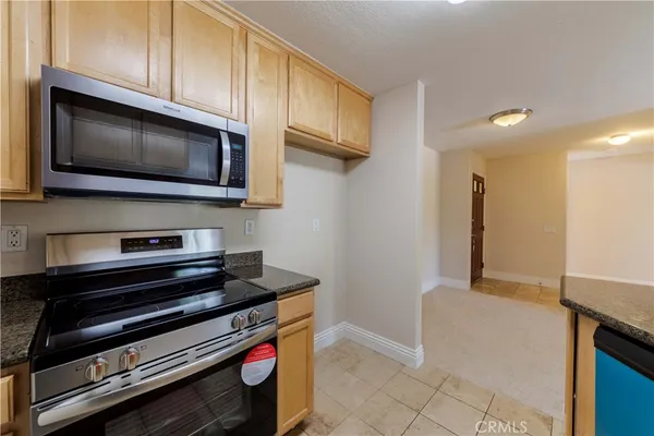 a kitchen with a stove and a microwave