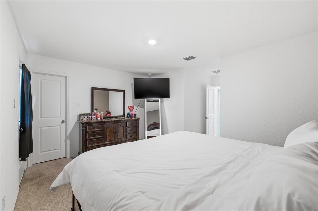 421 Corsair Way Ferris, TX 75125 - Photo 12 of 34 Bedroom with light colored carpet