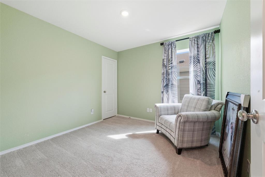 421 Corsair Way Ferris, TX 75125 - Photo 13 of 34 Living area with baseboards and carpet