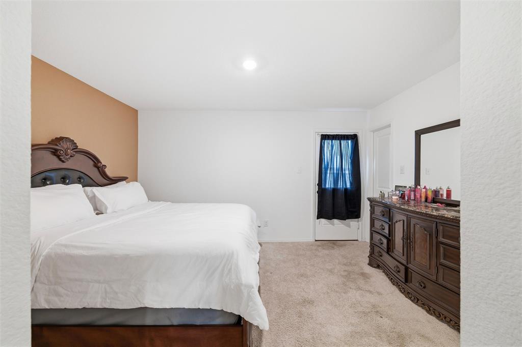 421 Corsair Way Ferris, TX 75125 - Photo 16 of 34 Bedroom with light carpet