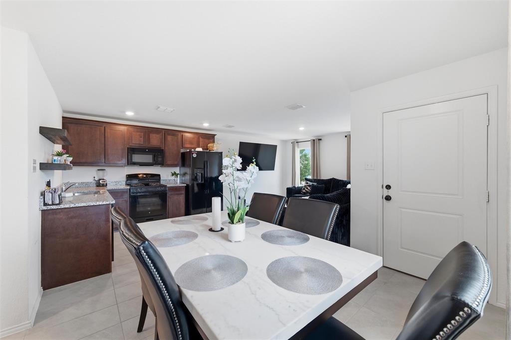 421 Corsair Way Ferris, TX 75125 - Photo 7 of 34 Dining space featuring recessed lighting and light tile patterned floors