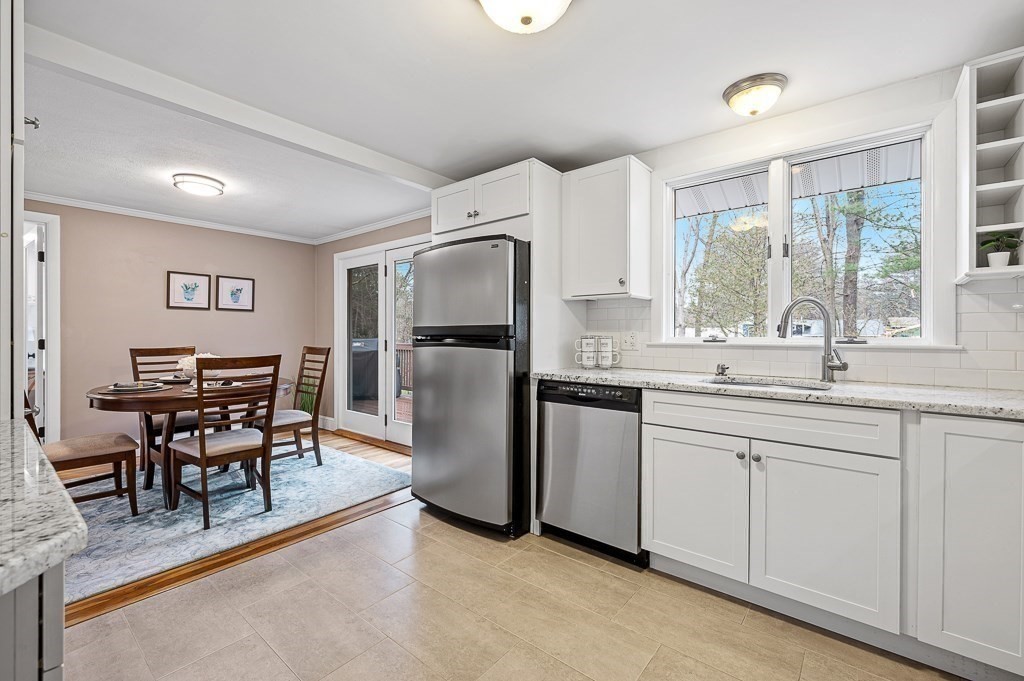 12 Sycamore Road Sudbury, MA 01776 - Photo 11 of 38 a kitchen with refrigerator and window