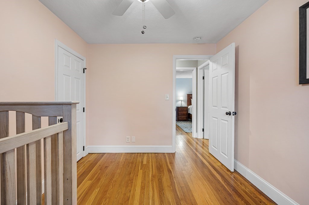 12 Sycamore Road Sudbury, MA 01776 - Photo 20 of 38 a view of a hallway with wooden floor and staircase